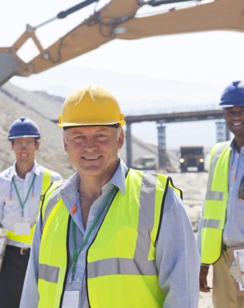 Business people standing in quarry
